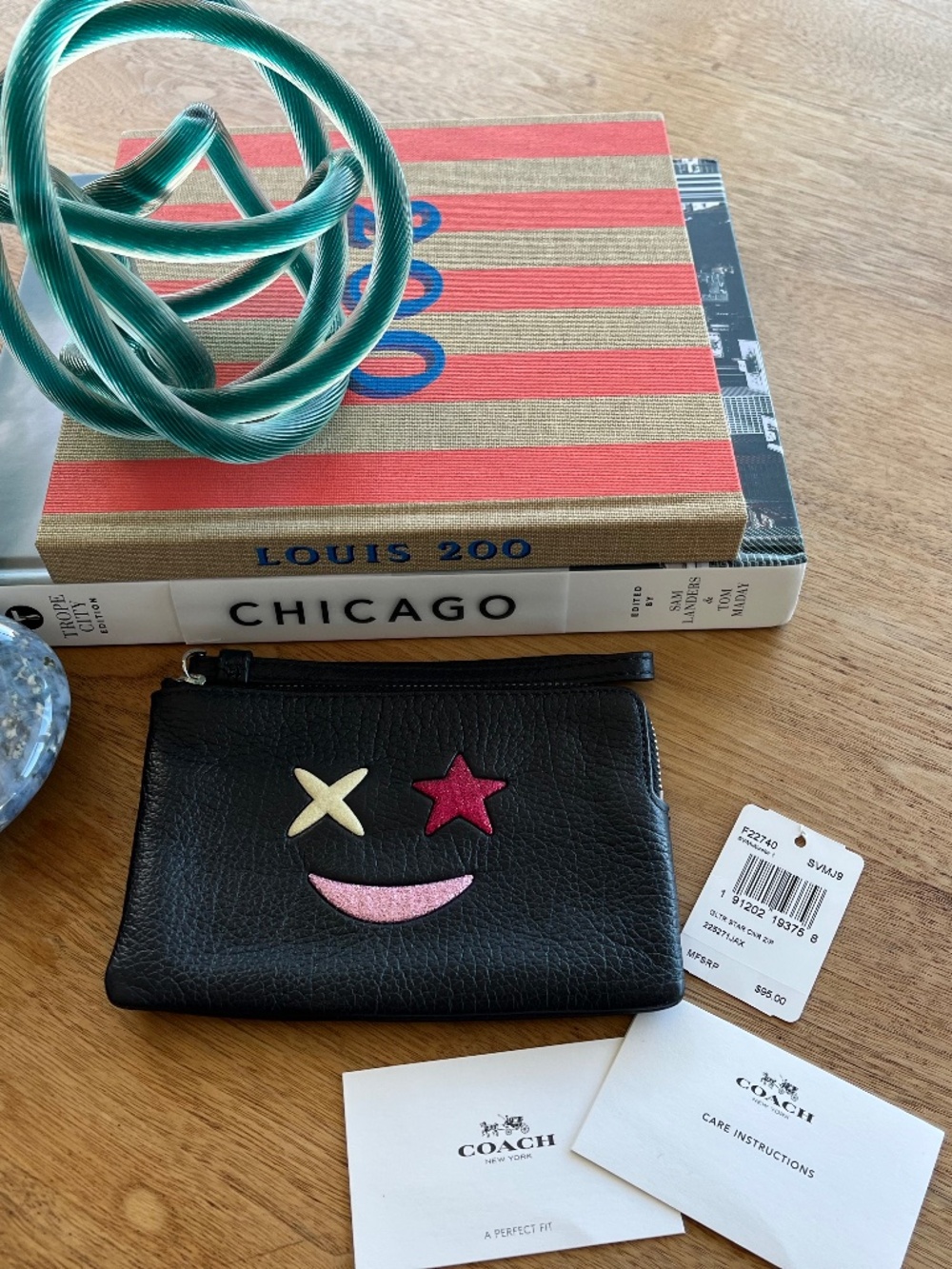 Too Cool for Boring: Coach Wristlet with a Rock Star Attitude